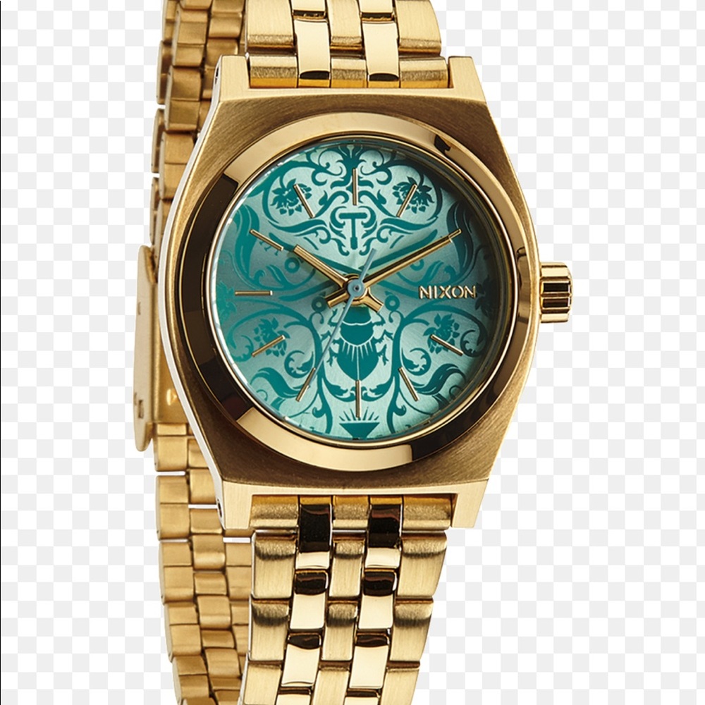 Nixon gold watch.